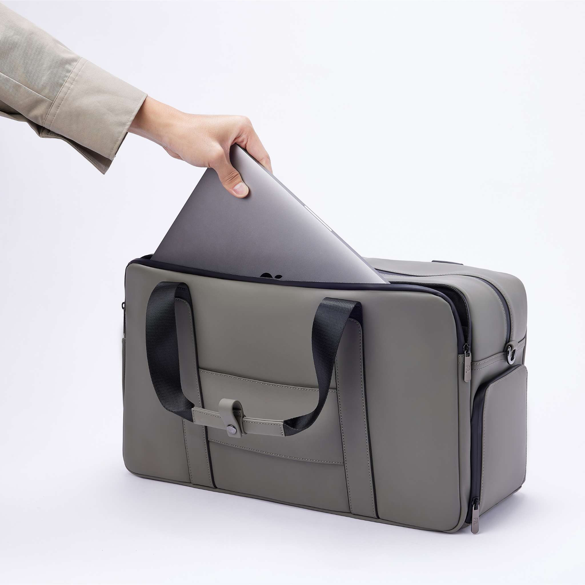 Men's laptop duffel bag in stone grey with dedicated padded sleeve, combining sleek design and tech-friendly functionality.