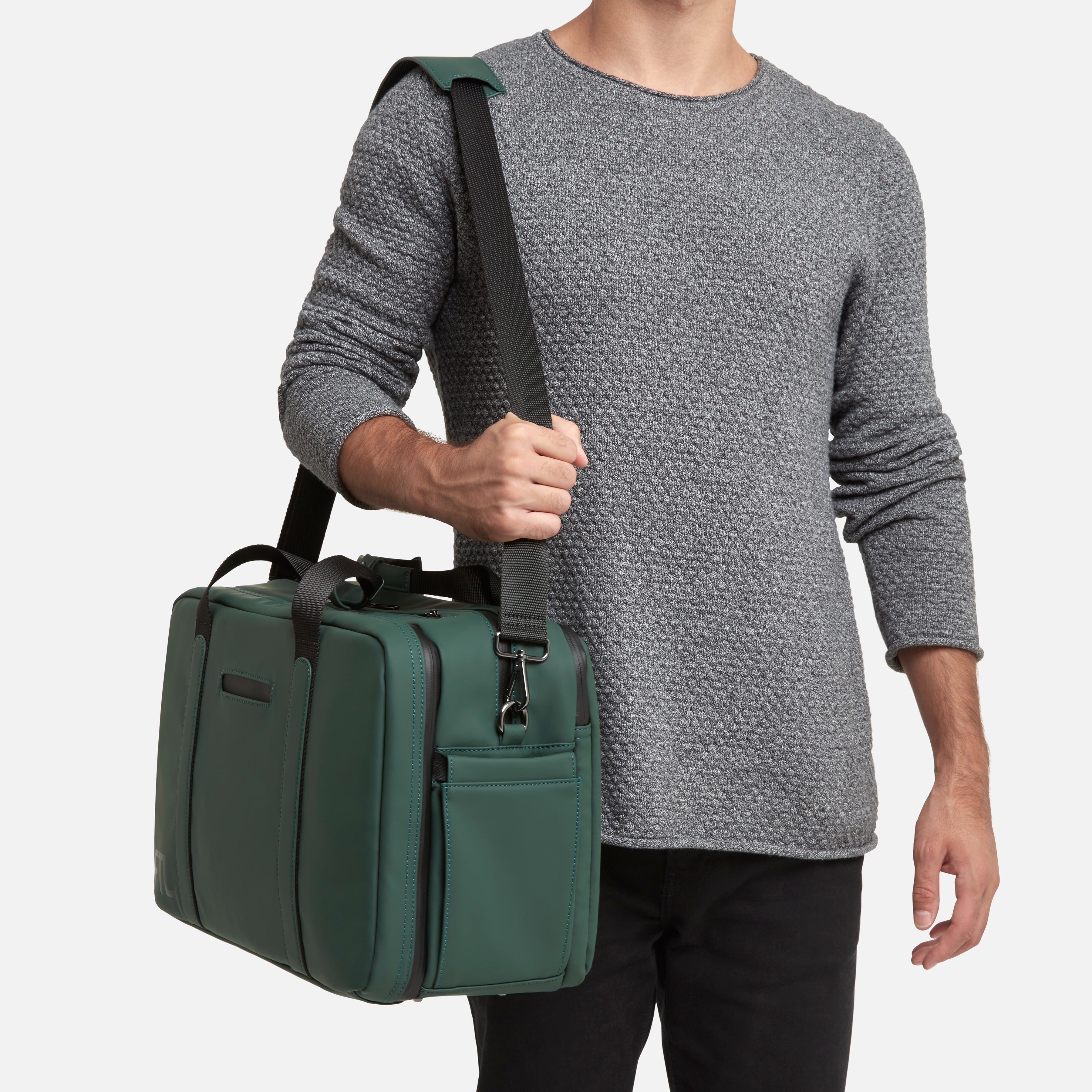 Men's gym duffel in green with adjustable shoulder strap and side pockets for stylish and functional daily use. Abbot Green,Kenmare Black,Essex Blue, Stone Grey